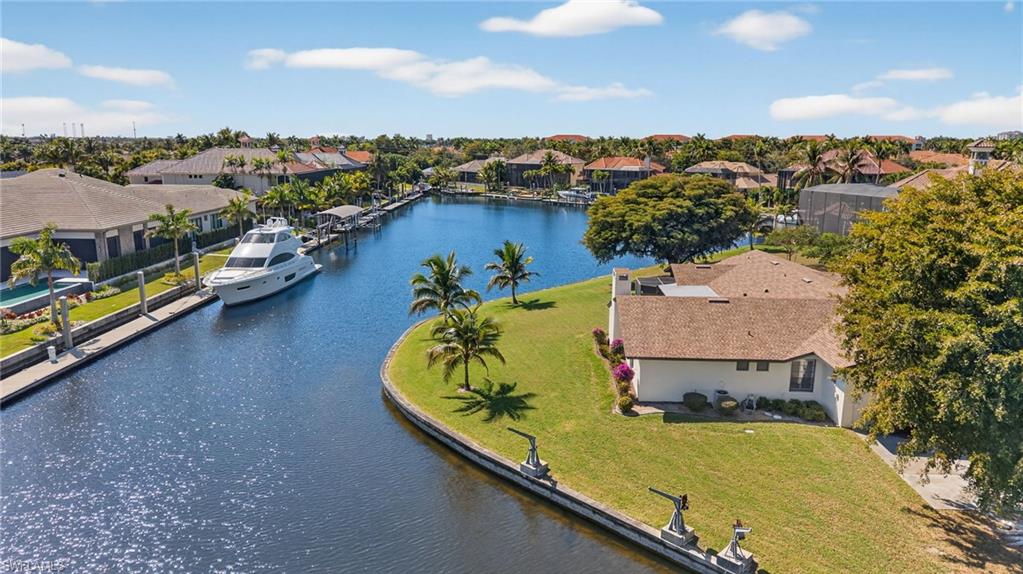 Aerial view of residential area featuring a large body of water