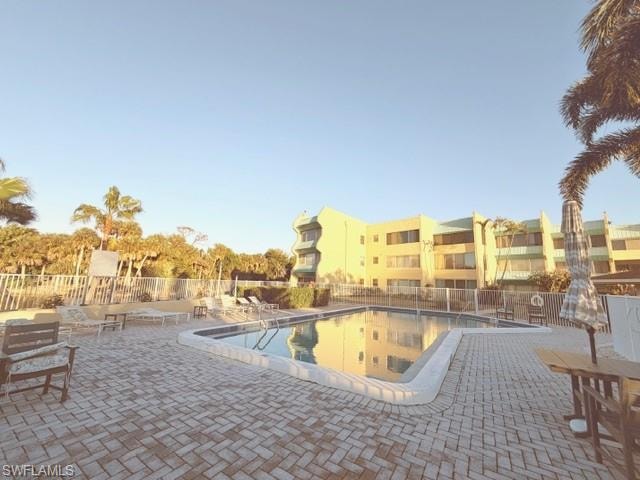 Community pool with a patio area