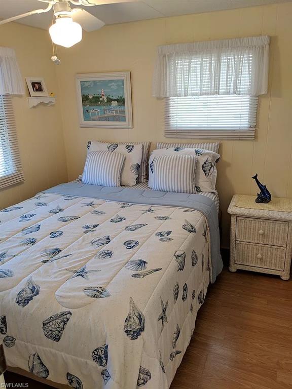 Bedroom featuring wood finished floors and ceiling fan