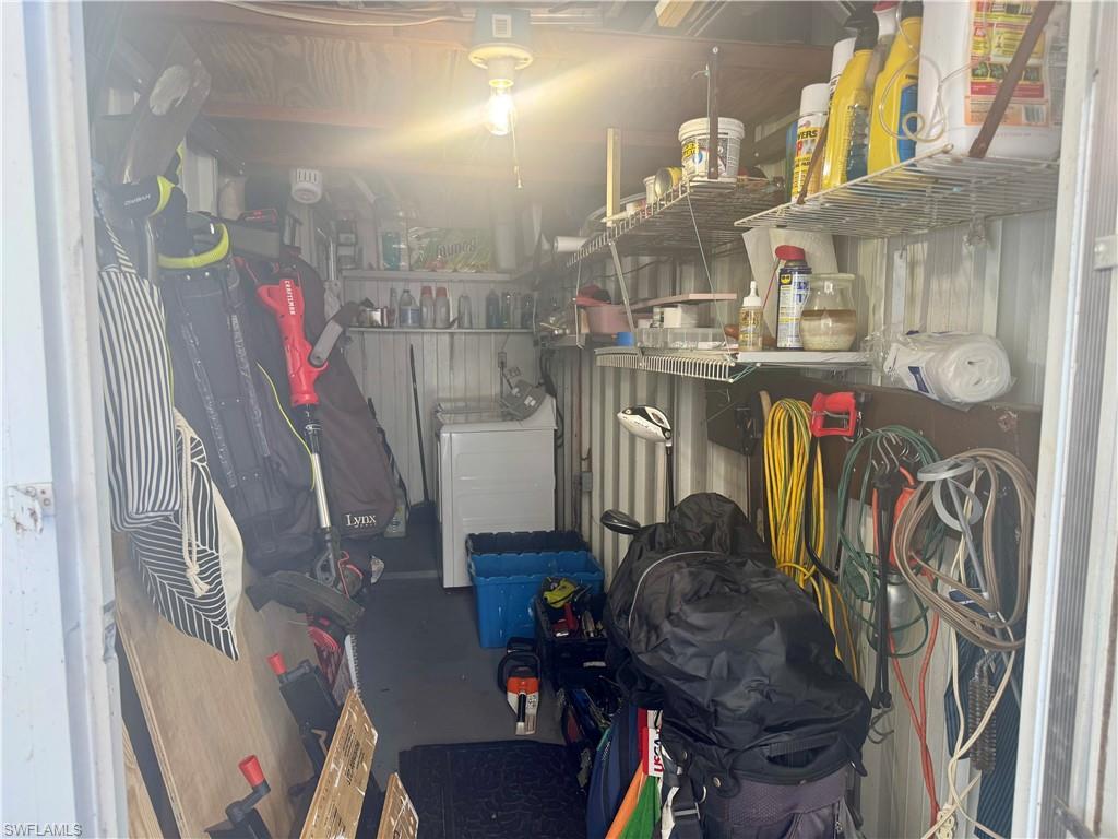 Storage room featuring washer / dryer