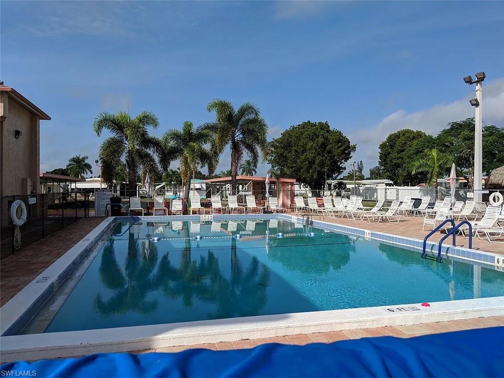 Community pool featuring a patio