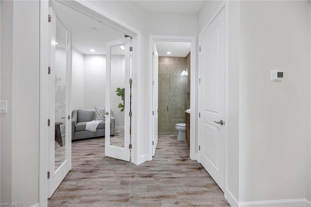 Den with glass doors perfect for an office.