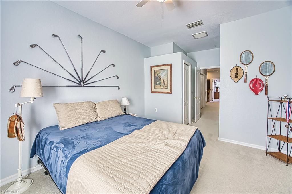 Bedroom featuring light carpet and a ceiling fan