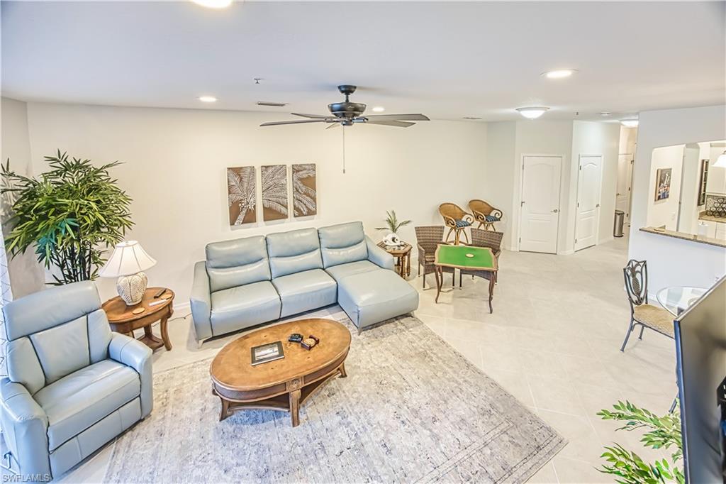 Living room featuring a ceiling fan and recessed lighting
