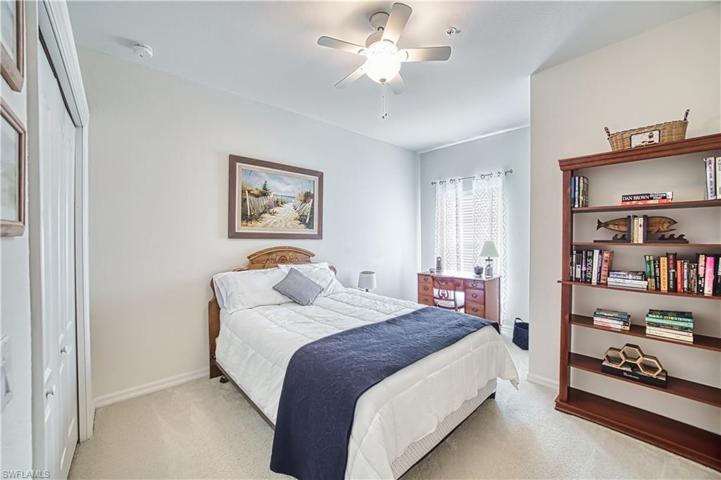 Bedroom featuring a closet, carpet, and ceiling fan