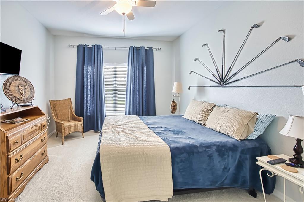 Bedroom featuring carpet and ceiling fan