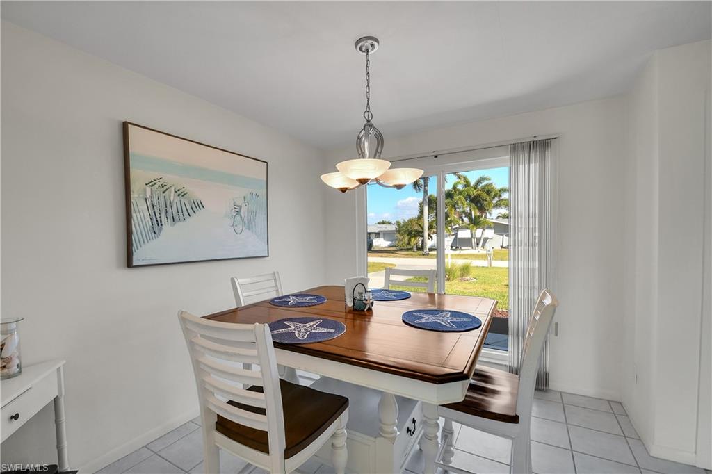 Dining open to living room and kitchen.