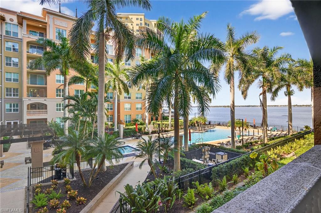 Community pool featuring a water view