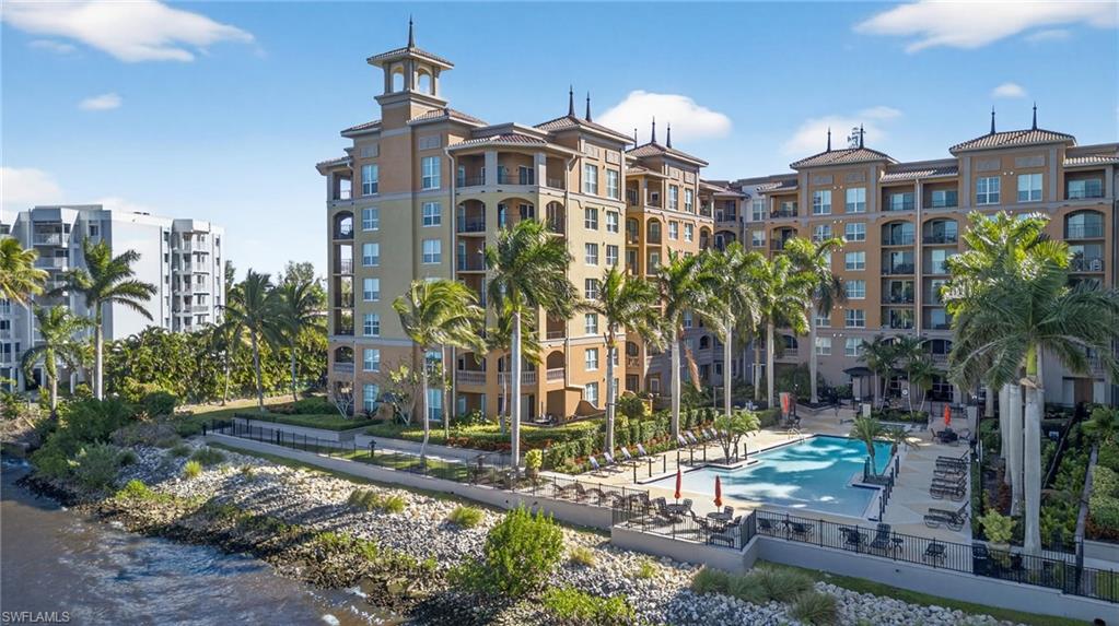 View of apartment building / complex featuring a community pool