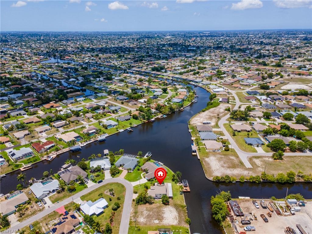 View of property location featuring nearby suburban area and a large body of water