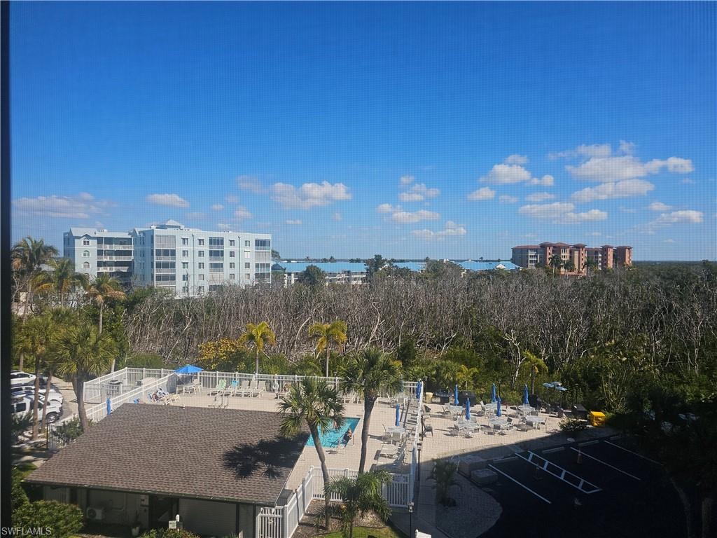 View from balcony of community pool, preserve & bay