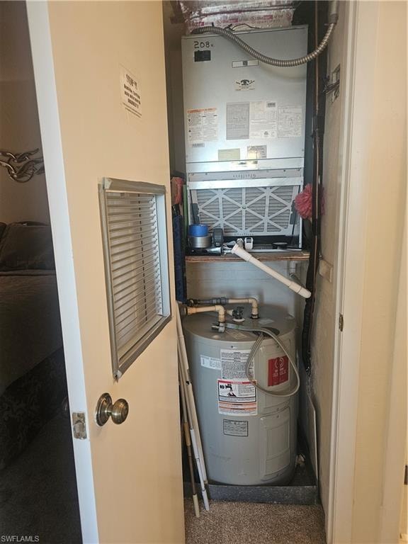 Utilities closet with water heater and HVAC air handler
