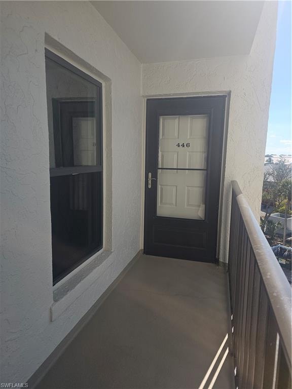 Entrance to property with freshly painted stucco exterior and views towards the beach, gulf and surrounding area from front balcony