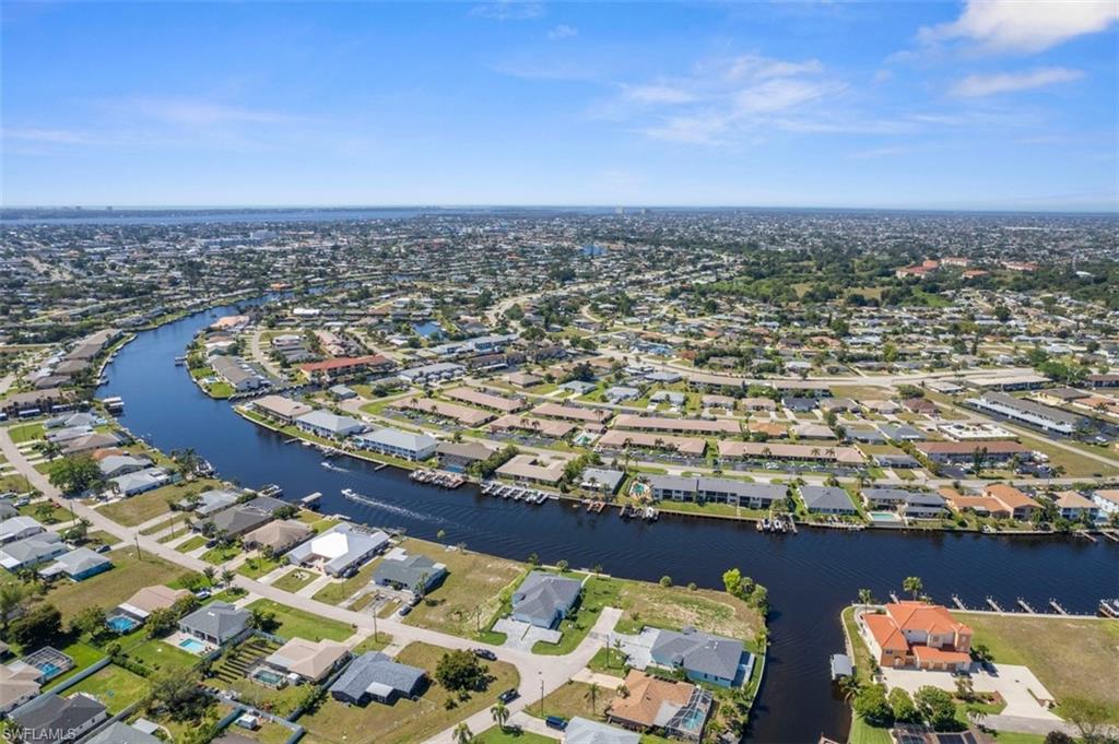 Bird's eye view with a water view and a residential view