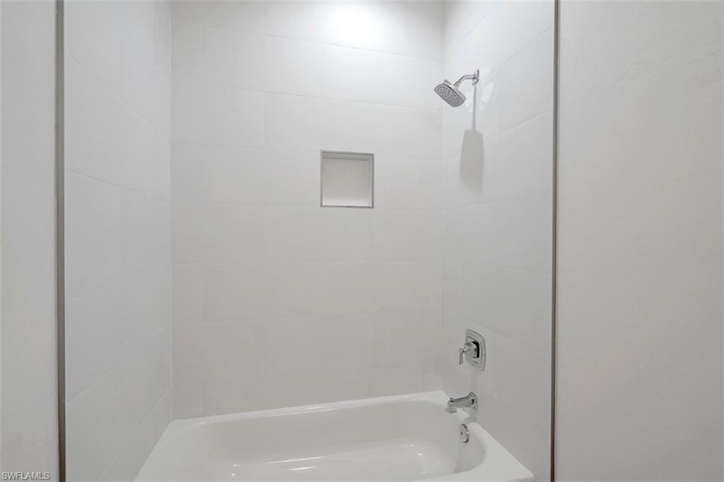 Bathroom with shower / washtub combination