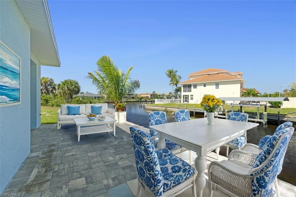 View of patio / terrace featuring an outdoor living space and a water view