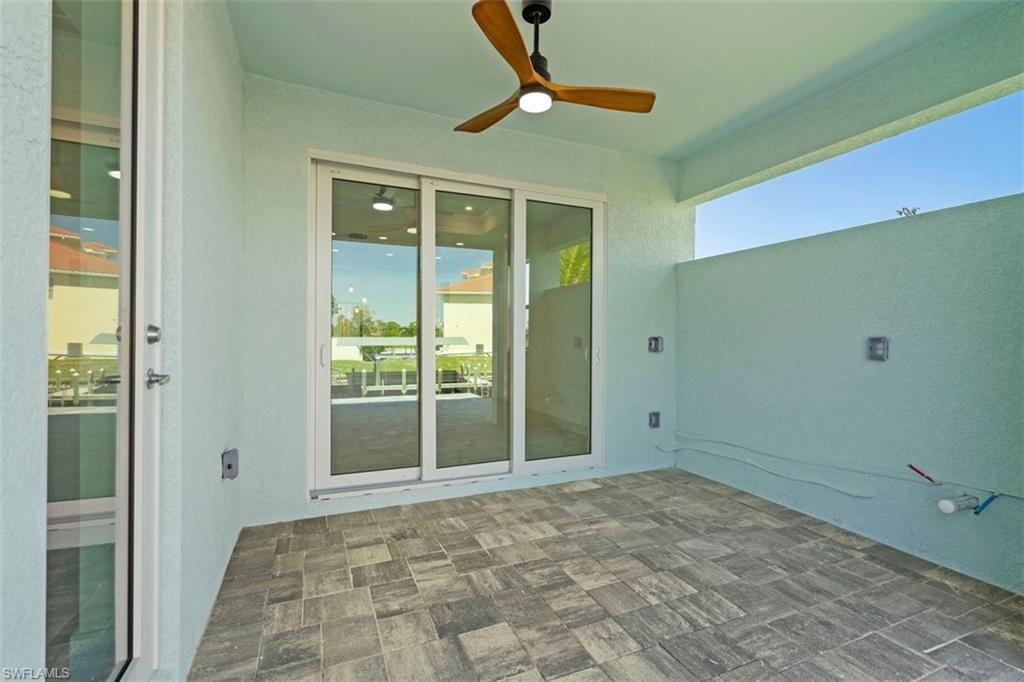 View of patio featuring ceiling fan