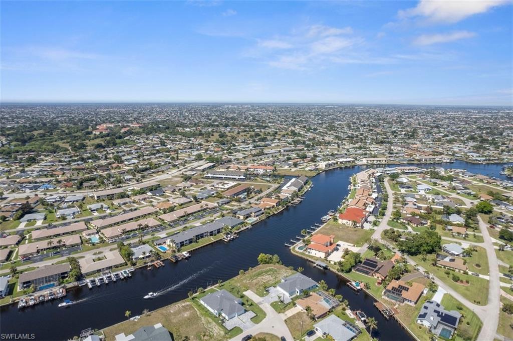 Birds eye view of property featuring a residential view and a water view