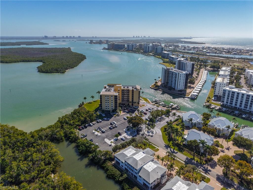 Aerial view of a large body of water and apartment complex / building