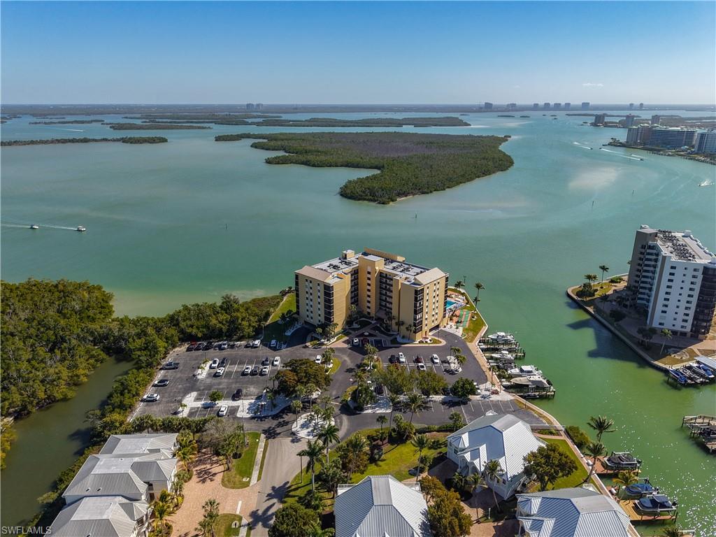 Bird's eye view of a nearby body of water and apartment complex