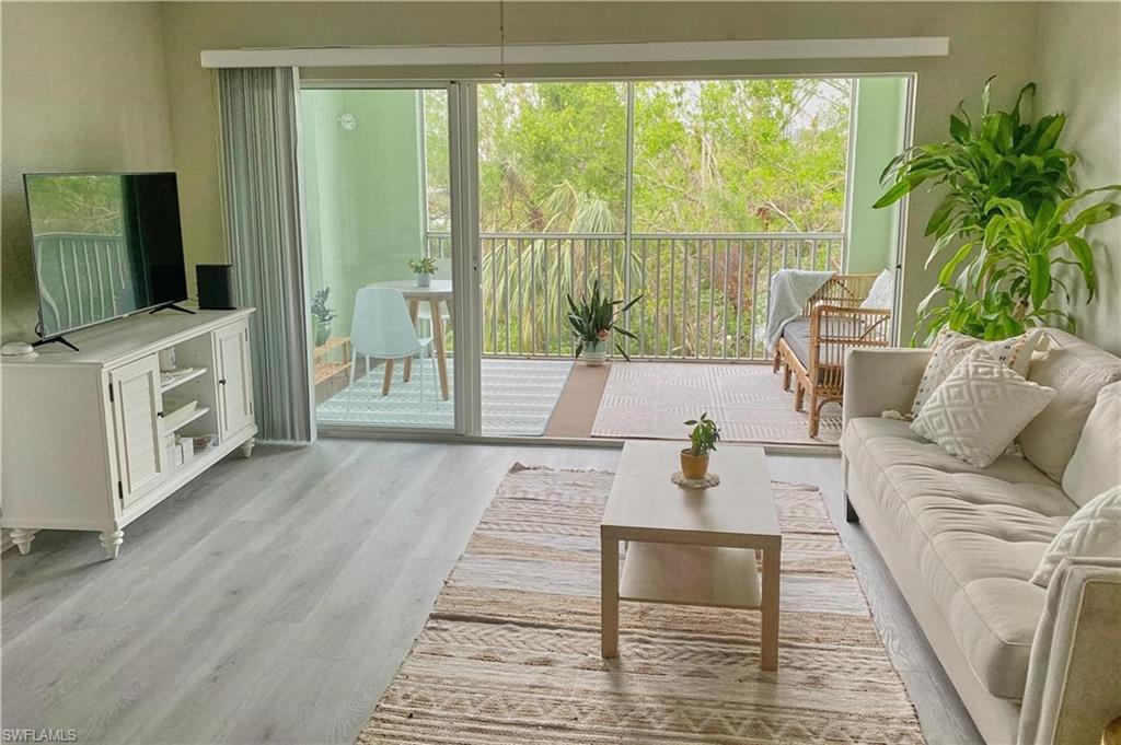Living area with light wood-style flooring