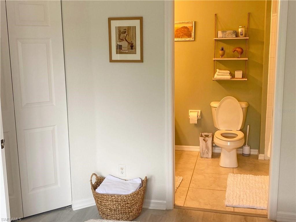 Bathroom with baseboards and tile patterned flooring