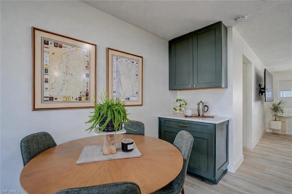 Dining room featuring light wood-style floors and baseboards