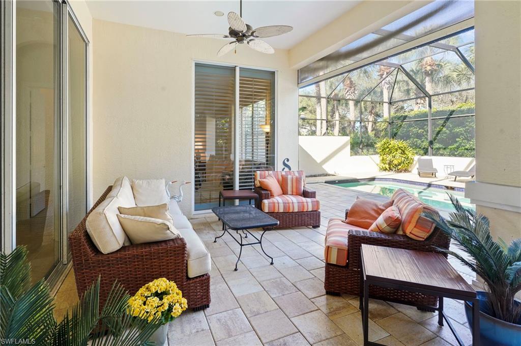 Sunroom with a patio, a ceiling fan, and outdoor furniture
