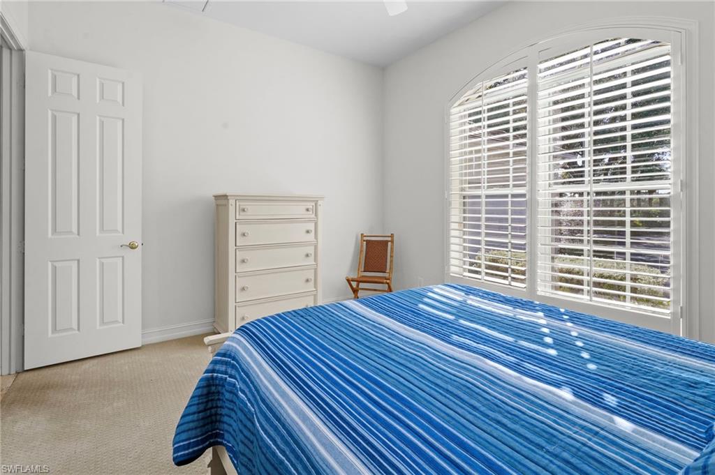 Bedroom featuring carpet flooring and ceiling fan