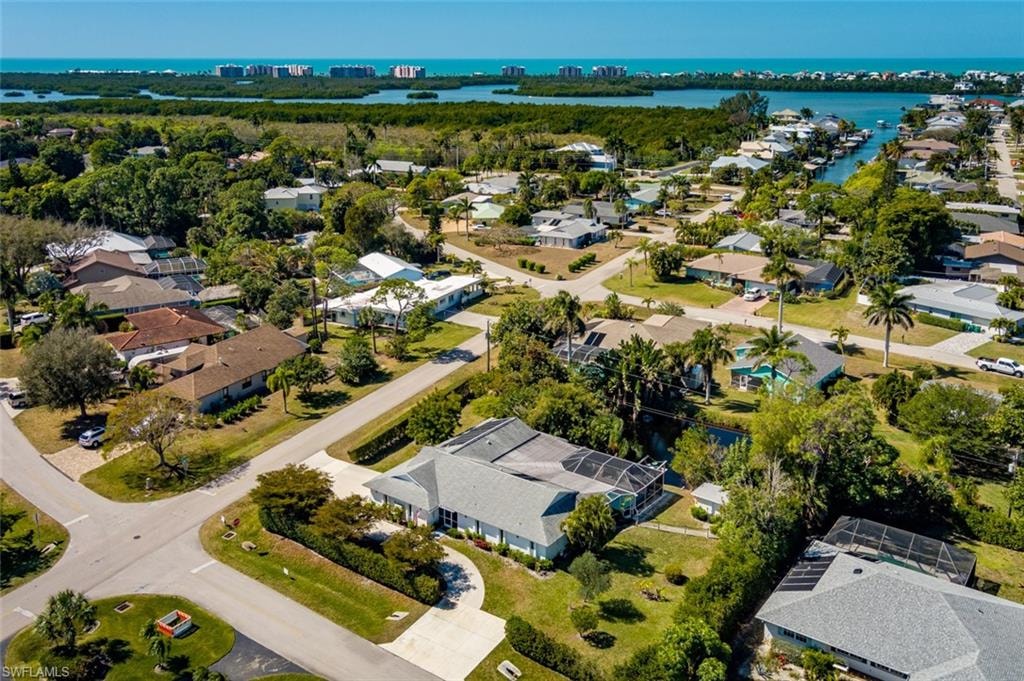 Aerial view of residential area featuring the gulf in the distance