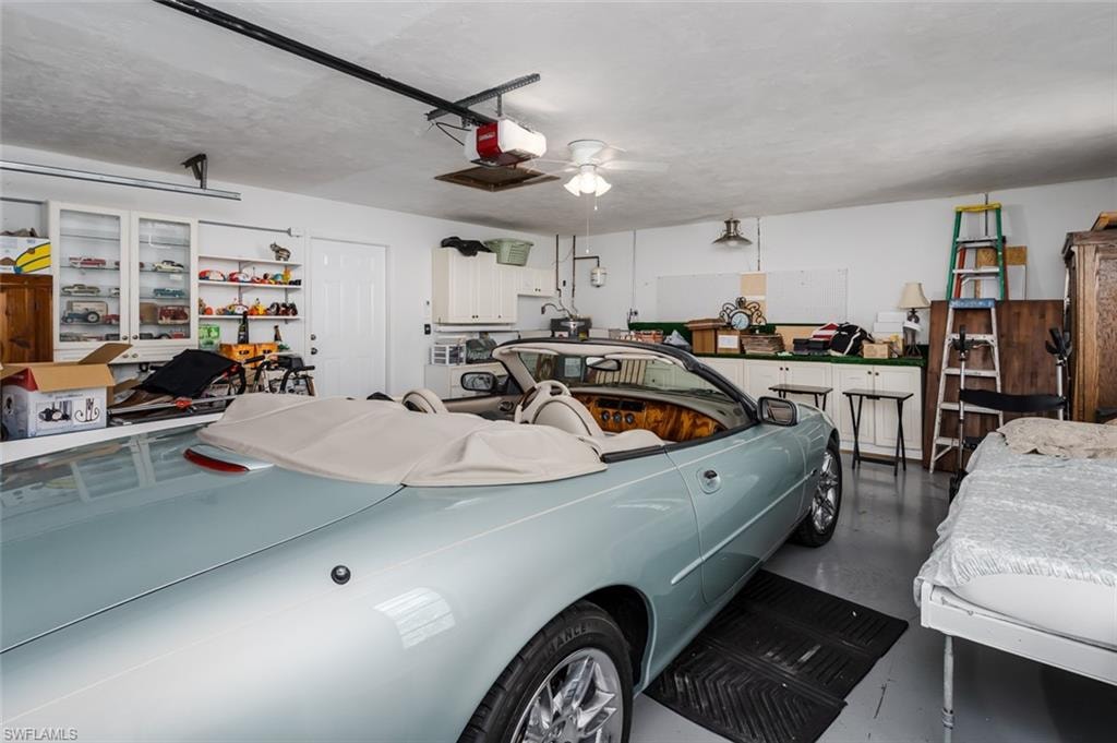 Garage featuring a garage door opener
