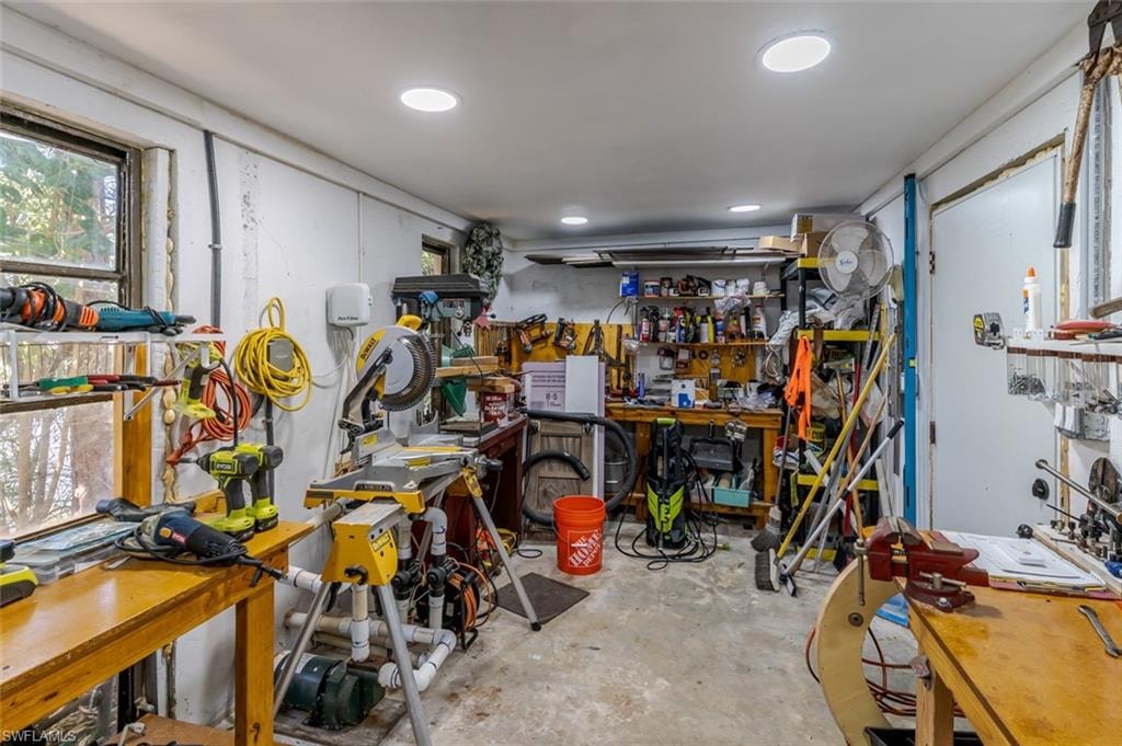Misc room with a workshop area and unfinished concrete floors