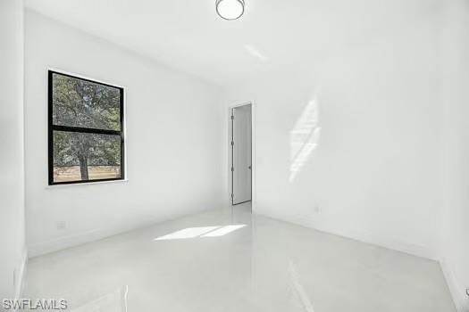 Spare room featuring concrete floors