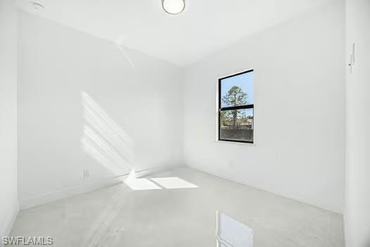 Spare room with finished concrete floors