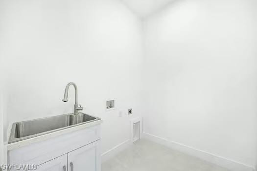 Laundry area featuring hookup for an electric dryer, washer hookup, and concrete flooring