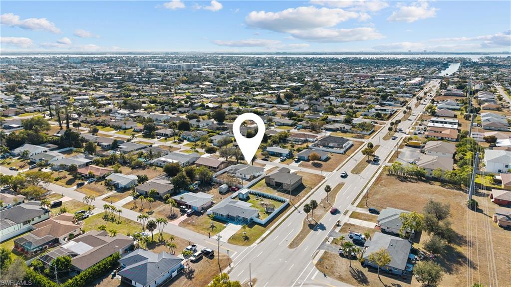 View of property location with nearby suburban area