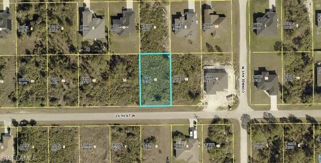 Aerial view of property's location featuring property parcel outlined
