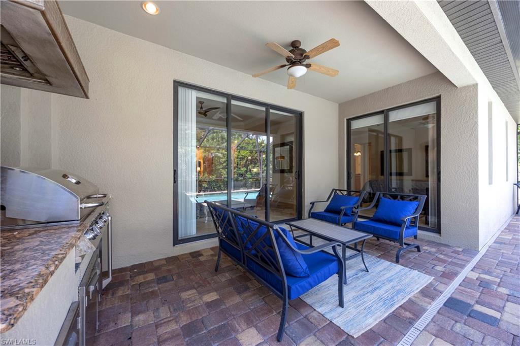 View of patio featuring grilling area, exterior kitchen, and ceiling fan