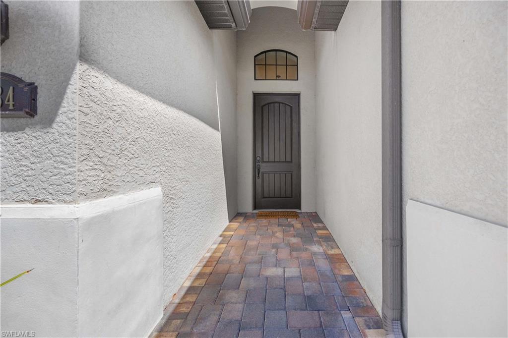 Entrance to property featuring stucco siding
