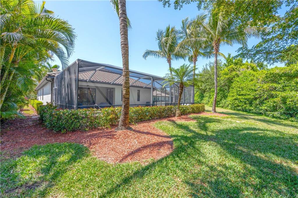 View of yard featuring a lanai