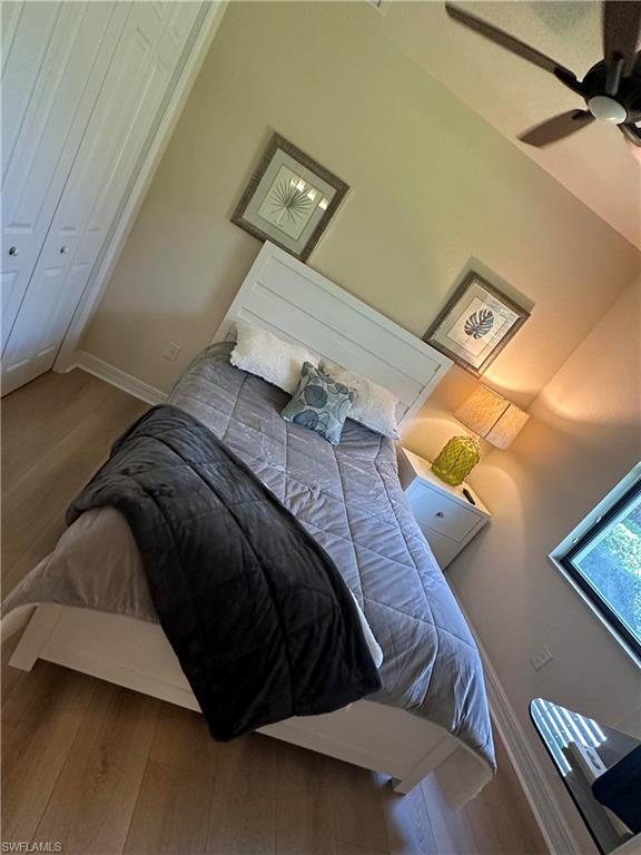 Bedroom # 3 featuring ceiling fan, baseboards, and wood finished floors