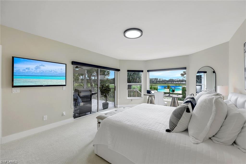 Bedroom with carpet floors and access to exterior