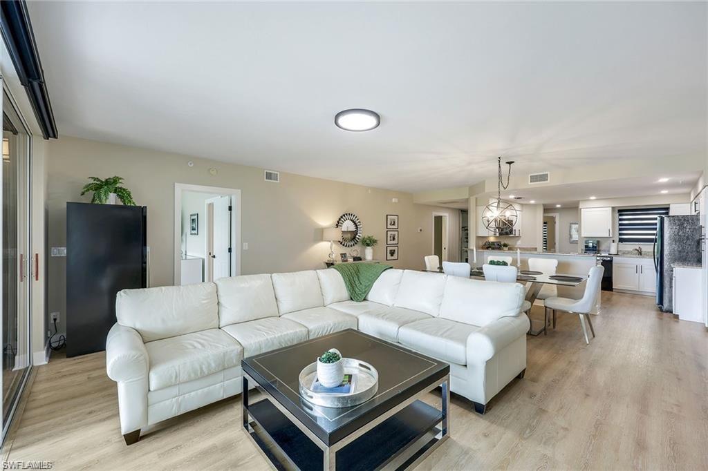 Living room featuring light wood-type flooring and recessed lighting