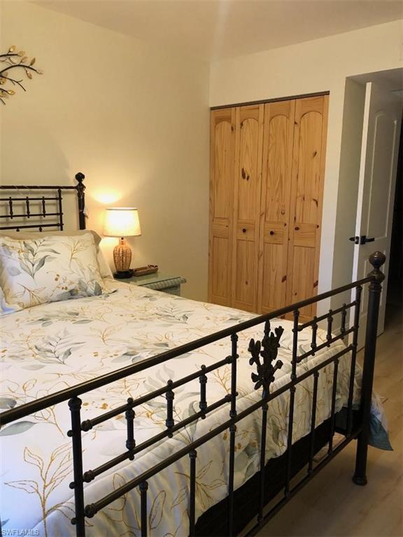 Bedroom with a closet and light wood-style floors