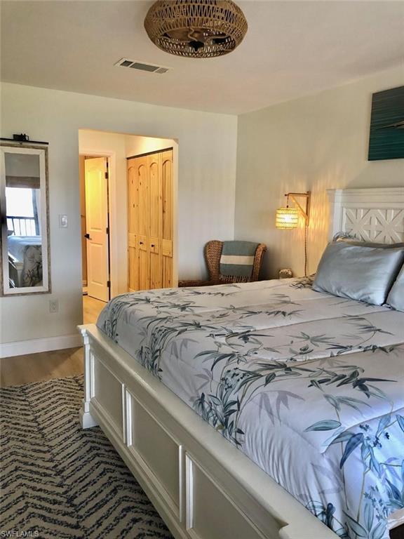 Bedroom with a closet and wood finished floors