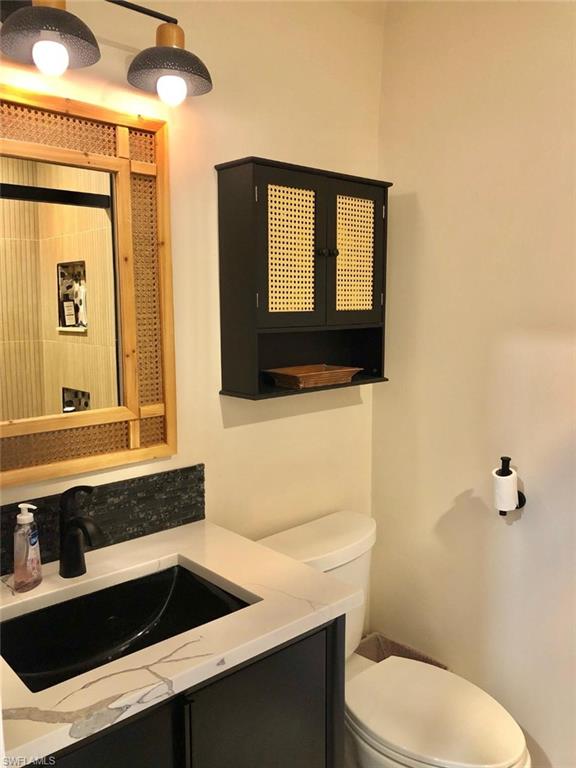 Half bath with toilet and vanity