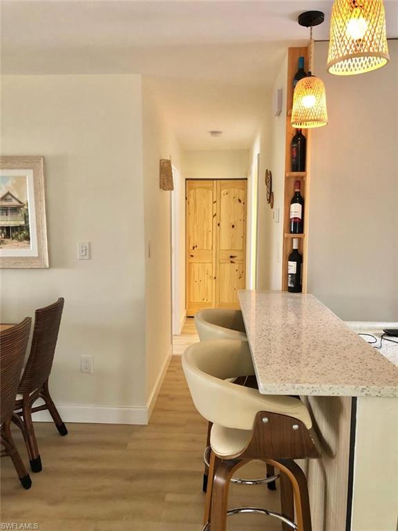 Dining space featuring light wood-style floors and baseboards