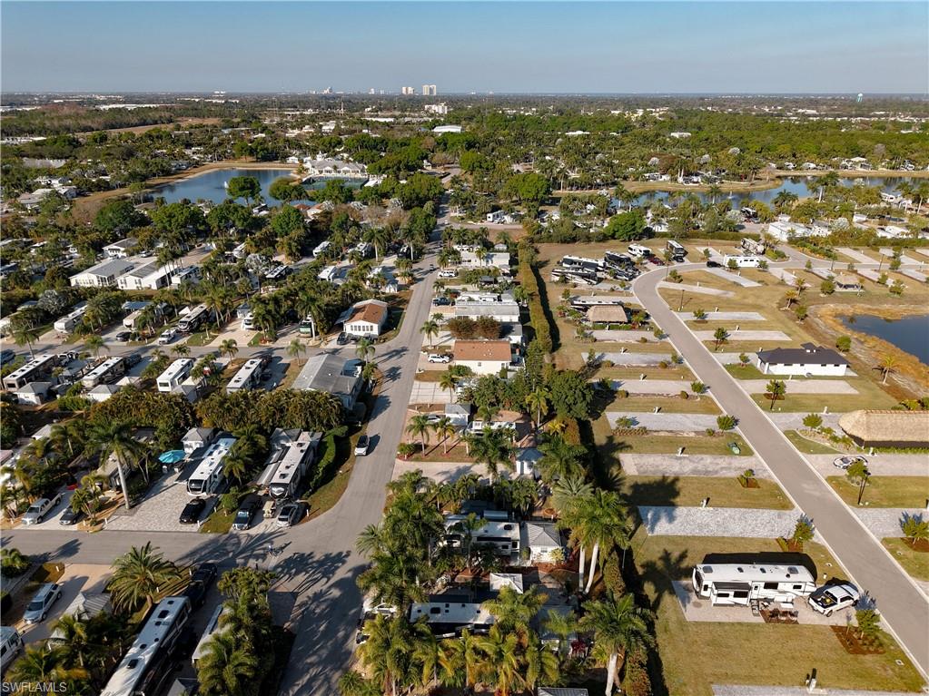 Aerial view of property's location with nearby suburban area and a nearby body of water