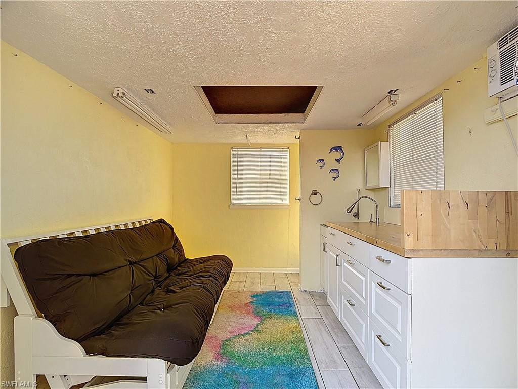 Living area featuring a textured ceiling