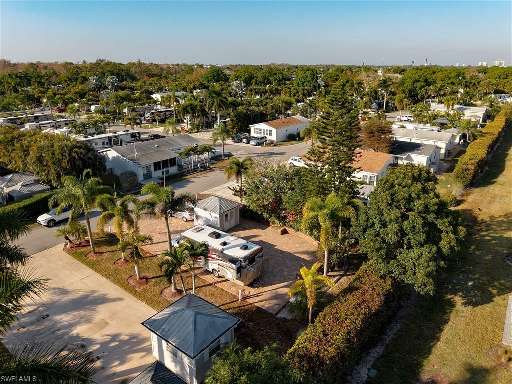 Aerial perspective of suburban area with a tree filled landscape